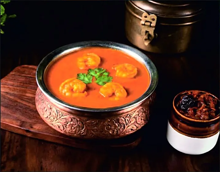 Prawn curry in a copper bowl