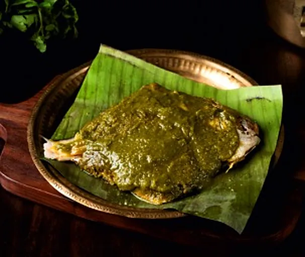 Patra fish steamed in a banana leaf with green chutney